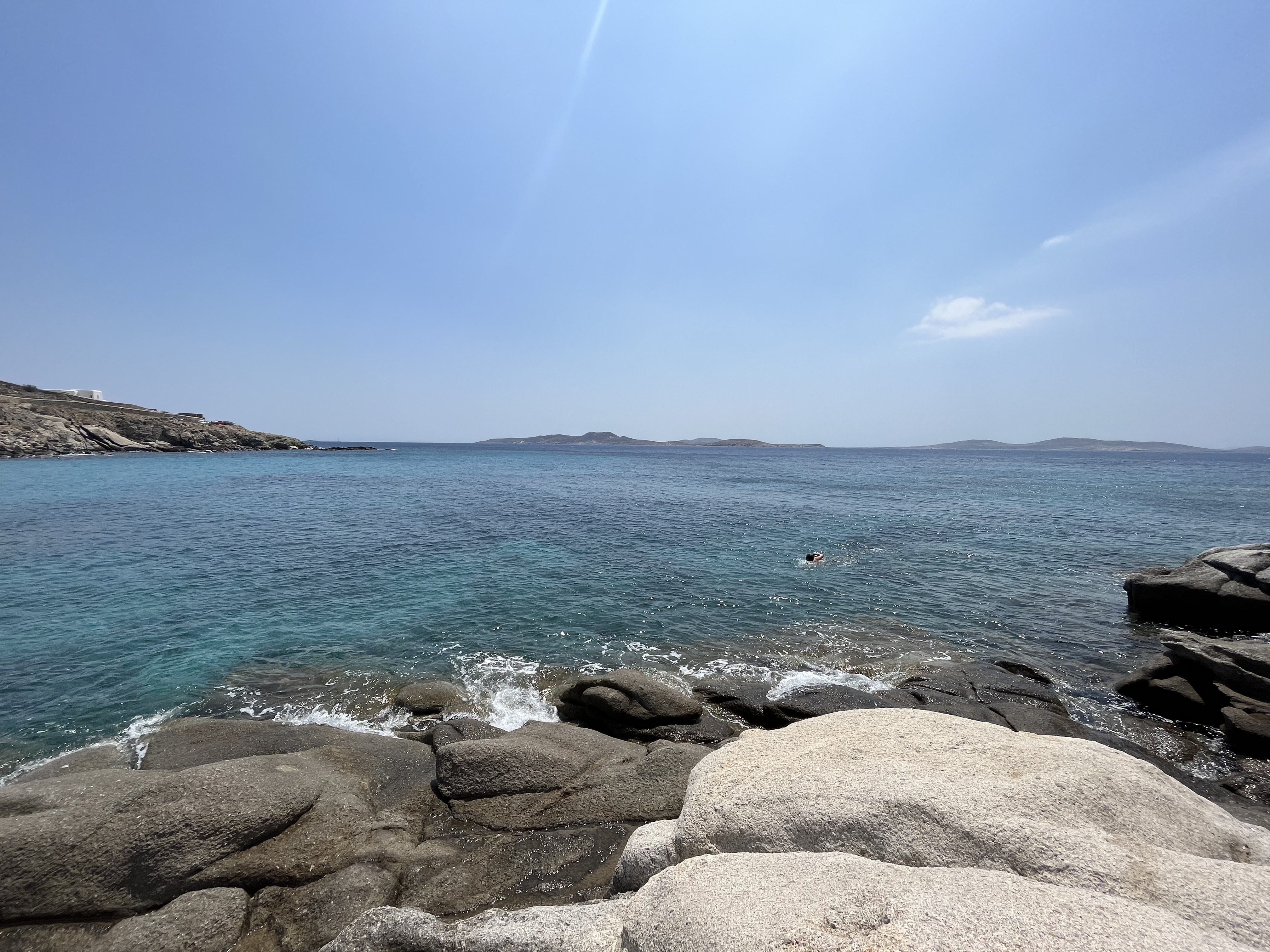 Sunbathing on rocky shores of Mykonos